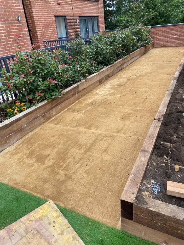 Prepared sand base before artificial lawn installation